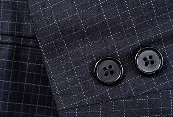 Wall Mural - Sleeve with buttons on the men's check suit. Men's suit. Part, item of clothing