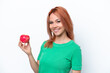 © luismolinero - Young Russian girl with an apple isolated on white background smiling a lot