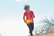 Pushing through the pain. Shot of an attractive young woman running outdoors with her hip injury highlighted.