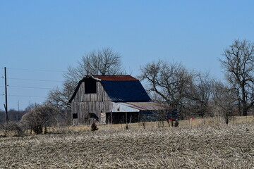 Canvas Print - Weathered Barn in a Field