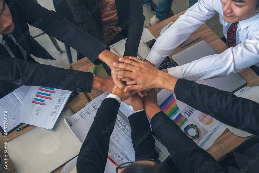 Diverse multiethnic Partners hands together teamwork group of multiracial people meeting join hands togetherness. Diversity people hands join empower partnership teams connection volunteer community