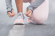 Stay focused on your end goal. Closeup shot of an unrecognizable persn tying their shoelaces while exercising.
