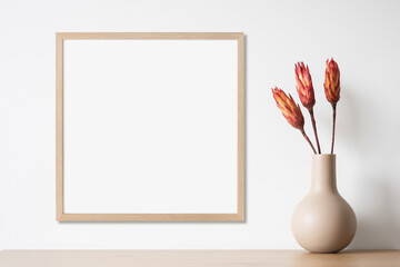 Wall Mural - Blank picture frame mockup on white wall, template for square artwork. View of modern minimal style interior with canvas for painting or photo on wall. Minimalism concept