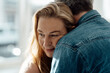 © Westend61 - Blond woman embracing man at home