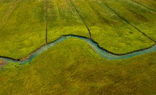 Drone View Of Zeller Ache River Flowing Through Green Meadow