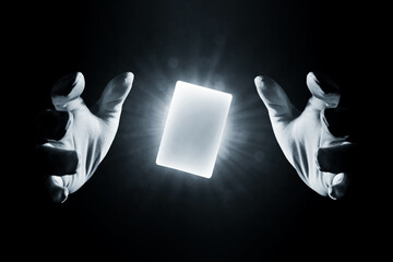 magician hands showing magic trick isolated on black background