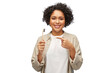 dental care, oral hygiene and people concept - portrait of happy smiling woman holding wooden toothbrush over white background