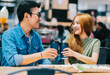 © Timeimage - Young Asian couple having lunch together in cafe
