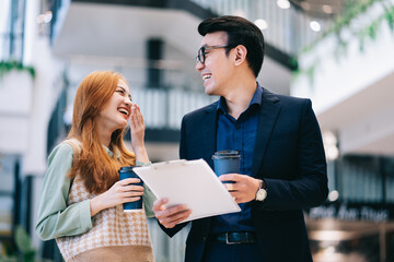 Portrait of young Asian business people at office