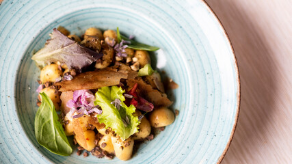 Wall Mural - mixed salad with bread crusts, potatoes and flowers