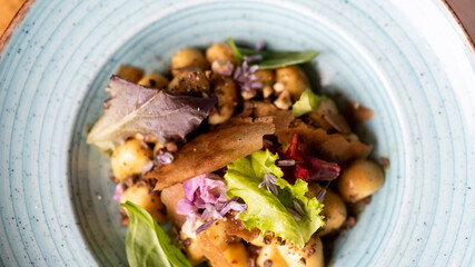 Wall Mural - mixed salad with bread crusts, potatoes and flowersmixed salad with bread crusts, potatoes and flowers