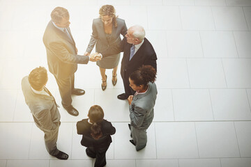 Were gonna do great things together. High angle shot of two groups of business teams meeting for the first time.