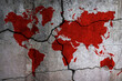 Silhouette of a world map on a cracked wall. Bloody trail in the form of the continents of the earth. War, the destruction of relations, the split of the world. Stop the war. International conflicts.