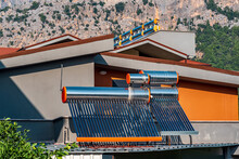 Solar Thermal Collectors Installed On The Roof Of A Residential Building