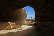 Empty Tomb Of Jesus Christ. Abandoned Shroud And Crown Of Thorns On The Floor. Light Pouring Into The Cave. 3d Illustration 