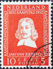 Wall Mural - Netherlands - circa 1952: a postage stamp from the Netherlands , showing a portrait of Jan Anthonisz Riebeeck (1619-77) founder of Capetown . 10 cent red