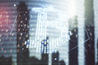 © Pixels Hunter - Double exposure of creative Bitcoin symbol hologram on modern skyscrapers background. Cryptocurrency concept