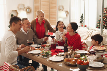 Canvas Print - Happy family enjoying festive dinner at home. Christmas celebration