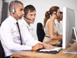 © T Hover/peopleimages.com - Have you turned it off and back on again. Shot of a group of help desk operators wearing headsets and working in an office.