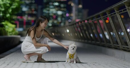 Poster - Woman cuddle her dog at outdoor in the evening