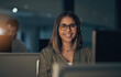 © Nicholas Felix/peopleimages.com - Ill take your call, no matter the time. Portrait of a call centre agent working in an office at night.