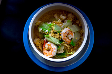 Wall Mural - Background of food menu (stir-fried noodles with fresh shrimp), a cup for cooking at home or serving food to customers.