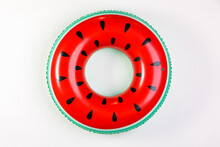 Top View Closeup Isolated Studio Shot Of Colorful Red And Green Watermelon With Black Seeds Round Shape Swimming Pool Lifesaver Kid Rubber Ring Using On Sea Beach Vacation Placed On White Background