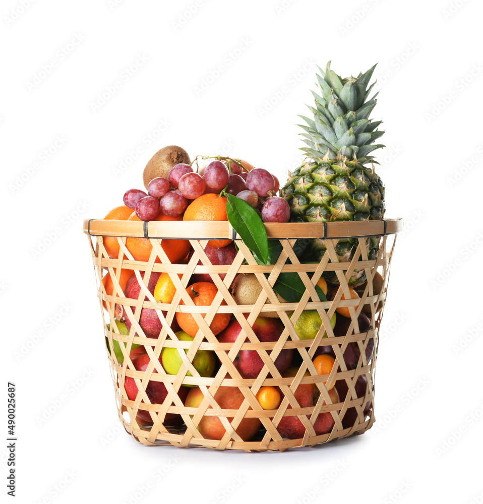 Basket with juicy fruits on white background