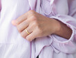 © wing-wing - Gold ring on ring finger left of Married woman close up. authentic skin tan asian. for couple love sweet valentine day or broken heart concept.