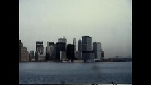 A Vintage Film Shot Looking Back From A Boat Toward The New York City Skyline From The 1970s.