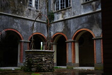 Well In The Middle Of The Cloister Of An Abandoned Monastery