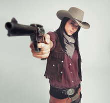 Im The Sheriff Around These Parts.... Full-length Shot Of An Attractive Young Woman In Cowboy Attire.