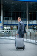© zinkevych - Back view of walking man with suitcase
