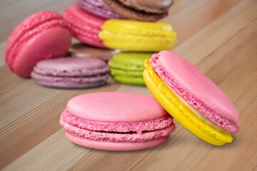 Wall Mural - French dessert for coffee. Multicolored macarons or macaroons on desk