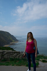 Poster - pregnant young woman posing by the sea