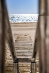 Sticker - Vertical shot of wooden dock into the shore in Spain