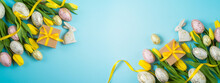 Easter Holiday Banner Design With Easter Golden Eggs, Gift Box And Yellow  Tulip Flowers. Top View With Copy Space