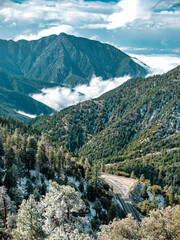 Wall Mural - Vertical shot of the beautiful green mountains against the sky.