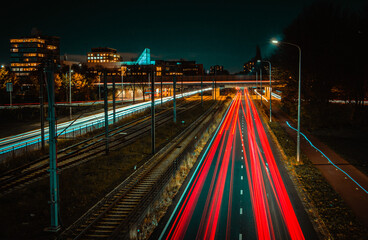 Wall Mural - Beautiful view of a colorful road  with motion lights of cars at night