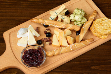 Wall Mural - High angle shot of a gourmet cheese and bread platter