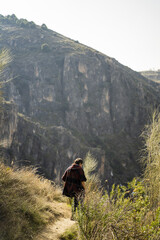 Poster - Caucasian female traveler enjoys the scenic view of Sierra Nevada mountain landscapes in Granada