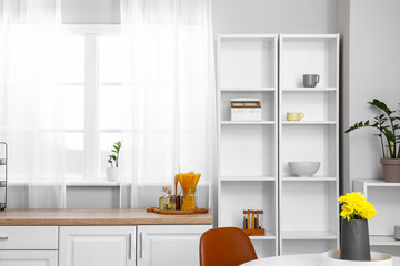 Wall Mural - Interior of light kitchen with white shelving unit