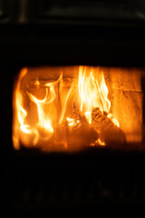 Canvas Print - Vertical shot of burning woods inside an oven