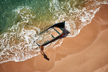 Sticker - Top view of Barbate Beach in Cadiz, Spain and an abandoned boat