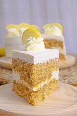 Poster - Slice of a sweet vanilla cake decorated with cream and the lemon slices