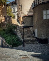 Sticker - View of urban stairs between old buildings with tiled floor