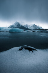 Sticker - Chilling view of a frozen lake in Iceland with mountain in the background