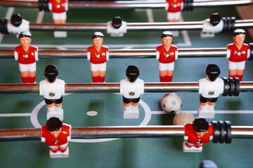 Wall Mural - Close-up shot of table soccer in action.