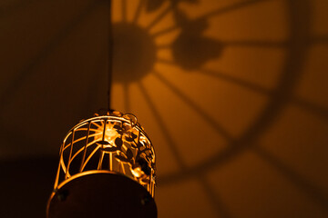 Poster - Closeup of a candle with a shadow on a ceiling