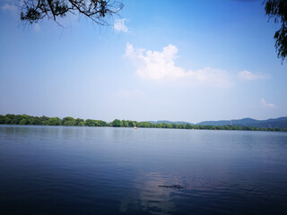 Wall Mural - vertical shot of the natural west lake with mountain view